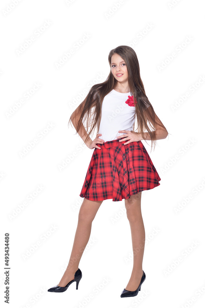 Happy little girl wearing high heels posing on white background Happy little girl wearing high heels posing on white background