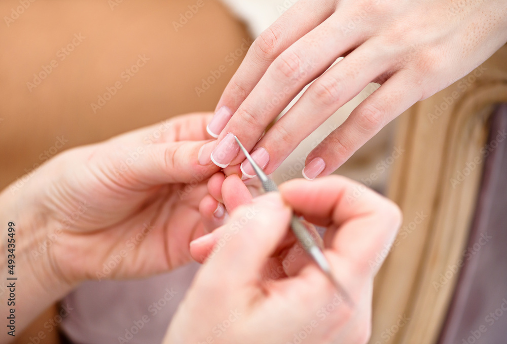 Faceless master doing manicure in beauty salon Faceless master doing manicure in beauty salon