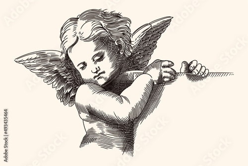 A small child angel with wings holds a nameplate in his hands. Medieval engraving isolated on a beige background.