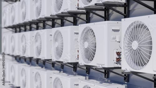 Air Conditioning Units In A Row On Building Facade photo
