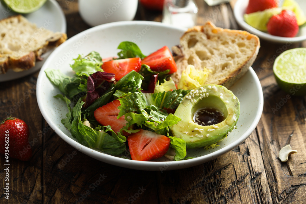 Healthy leaf salad with strawberry and avocado Healthy leaf salad with strawberry and avocado