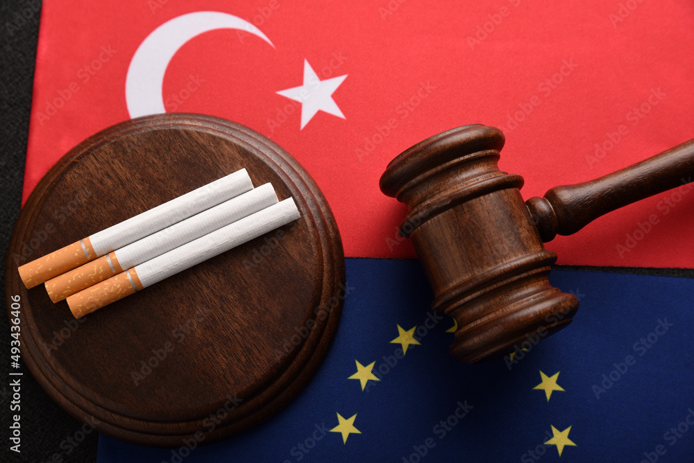 Cigarettes, Judge gavel on the flag of Turkey and the European Union. Illegal import of tobacco products.