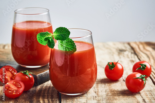 Tomato juice. Fresh red tomato detox juice in glass. Homemade tomato juice.