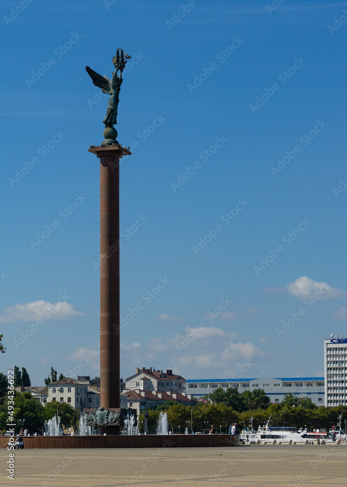 Embankment of Admiral Serebryakov in Novorossiysk. Stela Fountain Sea Glory of Russia. Angel with wings on the top of Column. Novorossiysk, Russia - September 15, 2021