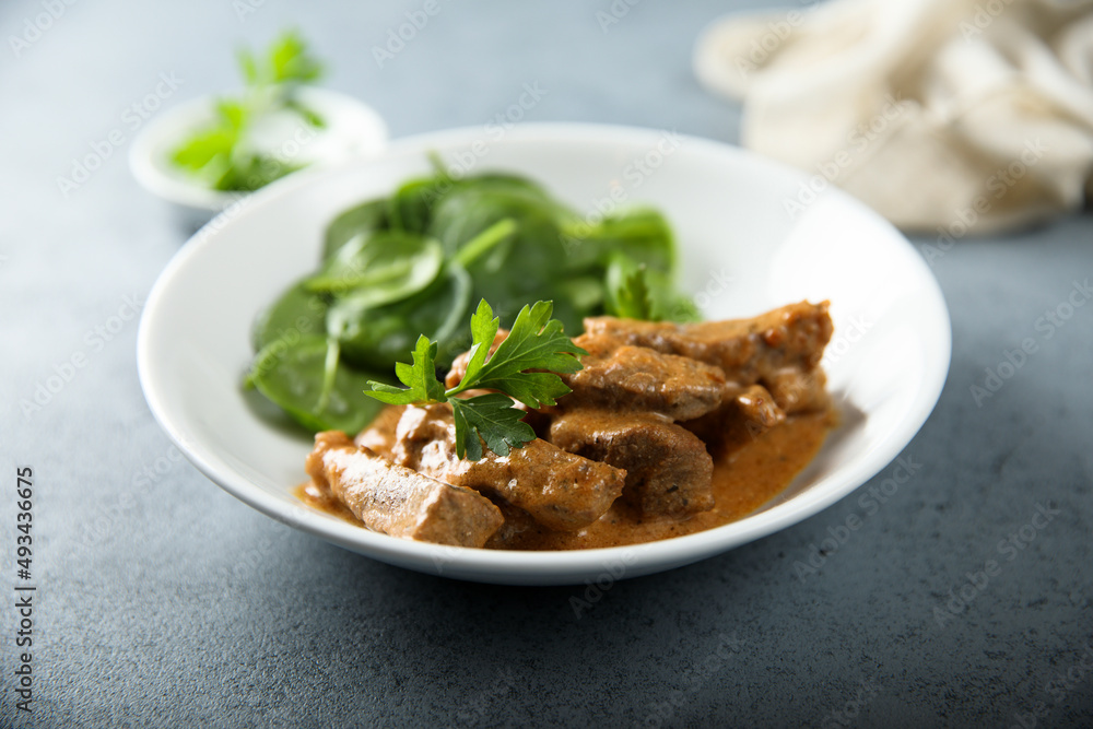 Homemade beef ragout with fresh spinach Homemade beef ragout with fresh spinach