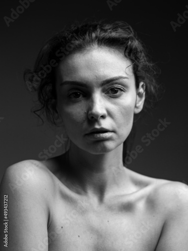 dramatic emotional portrait of a young girl with dark hair.grief emotion