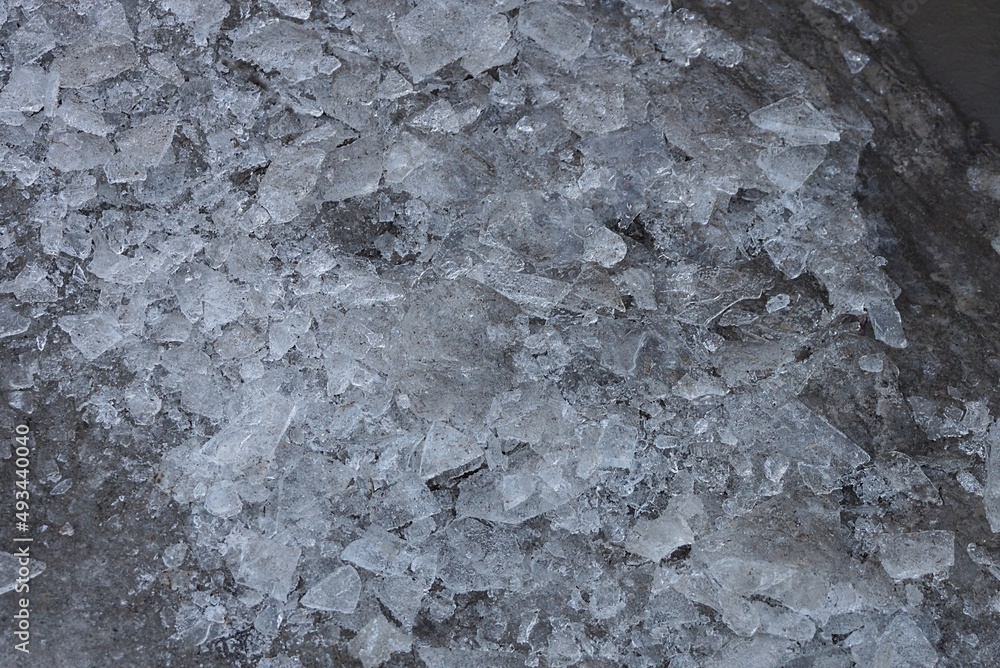 natural texture of gray dirty pieces of ice and water in the pond natural texture of gray dirty pieces of ice and water in the pond