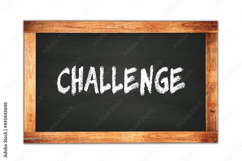 CHALLENGE text written on wooden frame school blackboard. CHALLENGE text written on wooden frame school blackboard.