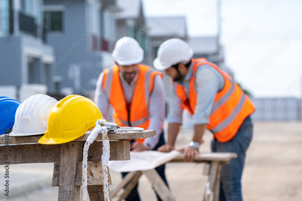 Yellow,white and blue hard safety helmet hat for safety project of workman or engineer in construction site. Yellow,white and blue hard safety helmet hat for safety project of workman or engineer in construction site.