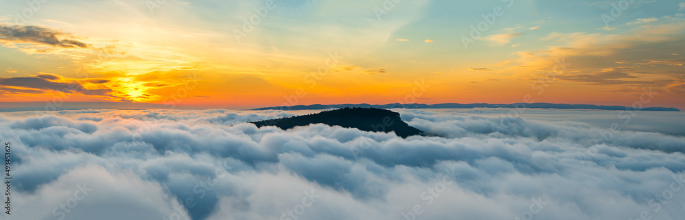 Panorama fog with vivid orange sunrise  sky clouds background