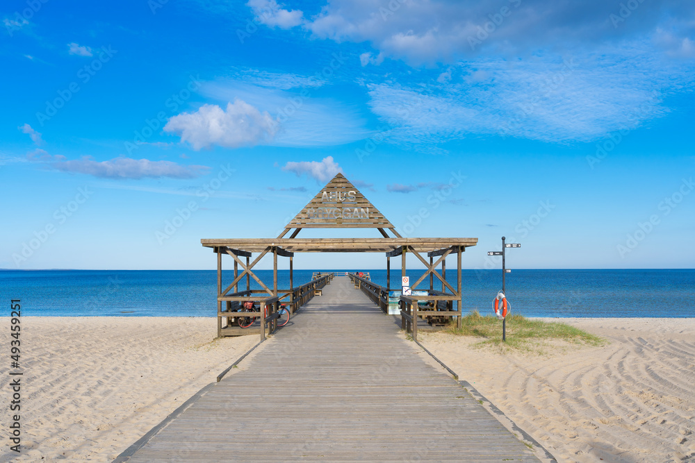 Wooden pier on the popular white sand beach situated in Ahus on the Swedish East Coast.