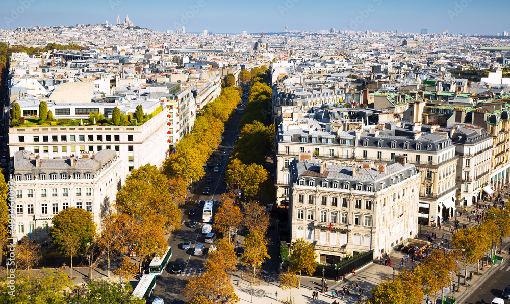 View of Paris autumn cityscape in sunny day from observation deck of Arc de Triomphe, France