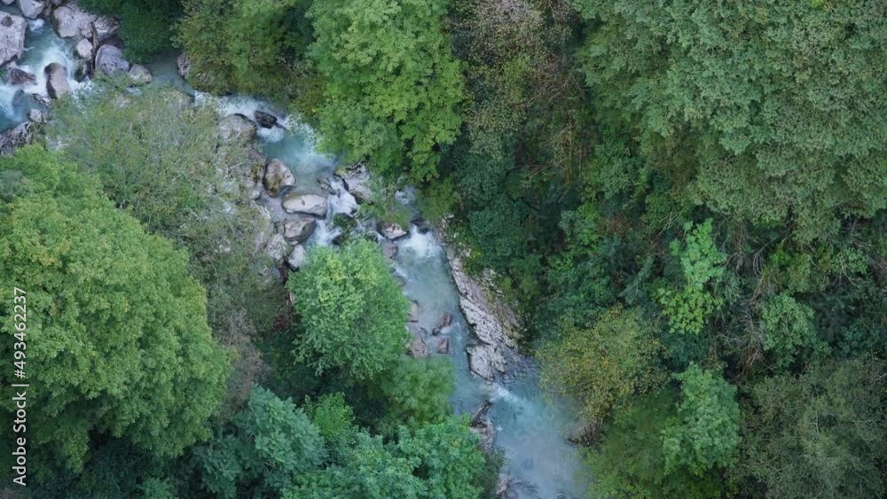 High view of the mountain river with rapids at the bottom of the green canyon. Slow motion. High view of the mountain river with rapids at the bottom of the green canyon. Slow motion.