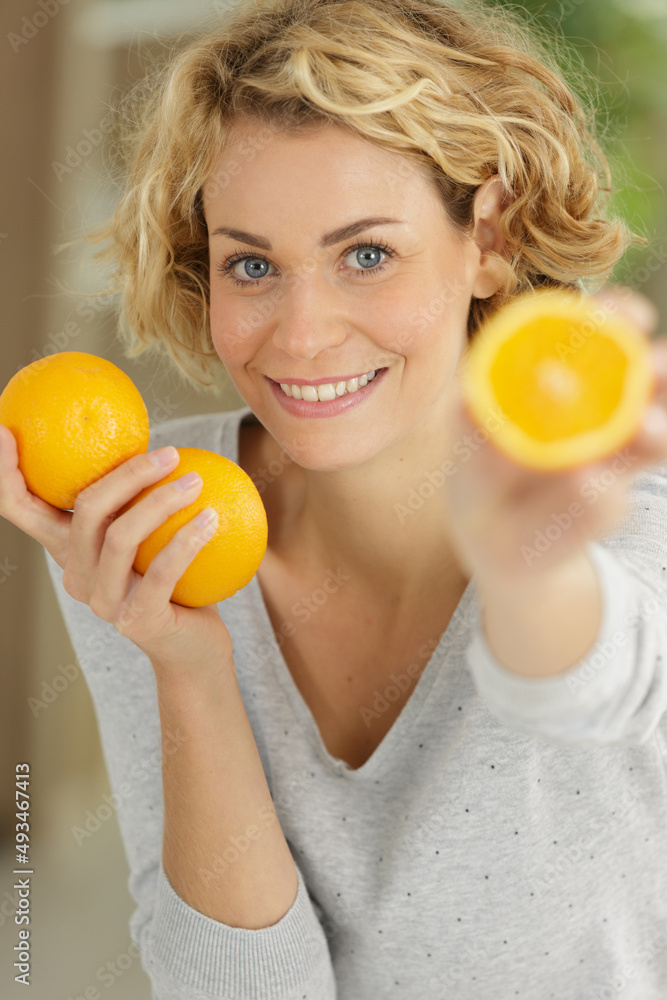 beautiful woman holding orange fruit beautiful woman holding orange fruit