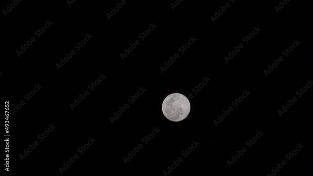 Hand held shot of Full moon in the sky during the night. Natural Moon background. Hand held shot of Full moon in the sky during the night. Natural Moon background.