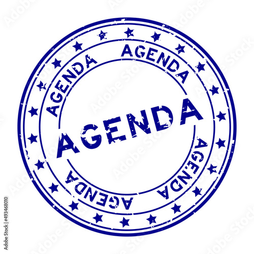 Grunge blue agenda word round rubber seal stamp on white background