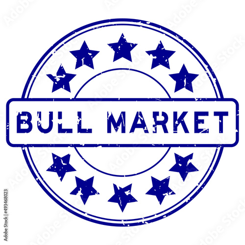 Grunge blue bull market word with star icon round rubber seal stamp on white background