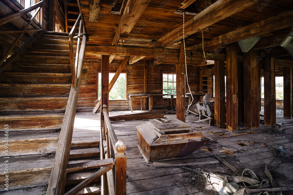 The interior of an old abandoned mill. The picture was taken in the village of Pervokrasnoe, in the Orenburg region The interior of an old abandoned mill. The picture was taken in the village of Pervokrasnoe, in the Orenburg region