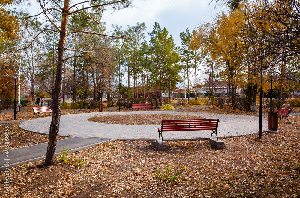 Benches in the autumn park. Russia, Orenburg city, Kargala settlement Benches in the autumn park. Russia, Orenburg city, Kargala settlement
