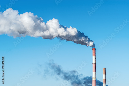 Smoke and chimneys of an industrial enterprise. The picture was taken in Russia, in the city of Orenburg