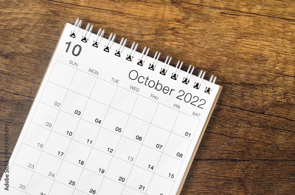 October 2022 desk calendar on wooden background. October 2022 desk calendar on wooden background.
