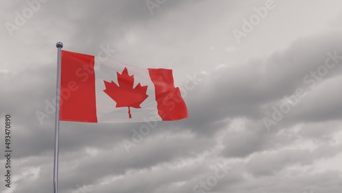 flag of Canada in the wind against the grey sky. National Holiday, Canada Day