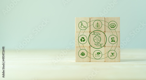 Environmental sustainable concept. Save of earth and environment, net zero emissions and carbon neutral. Wooden cubes with save world and eco friendly icons. World earth day. Eco friendly companies.