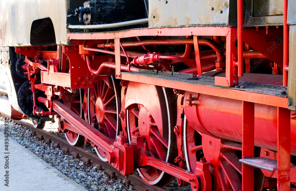 Old steam locomotive wheels close up.