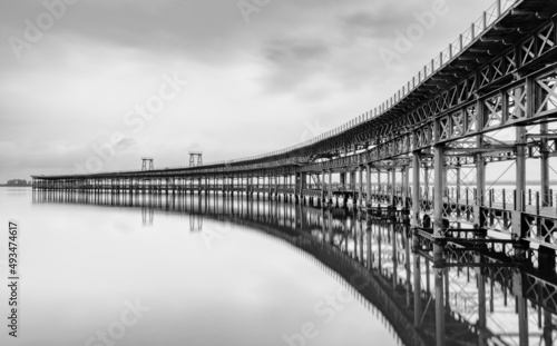black and white long exposure of the historic Rio Tinto pier in Huelva
