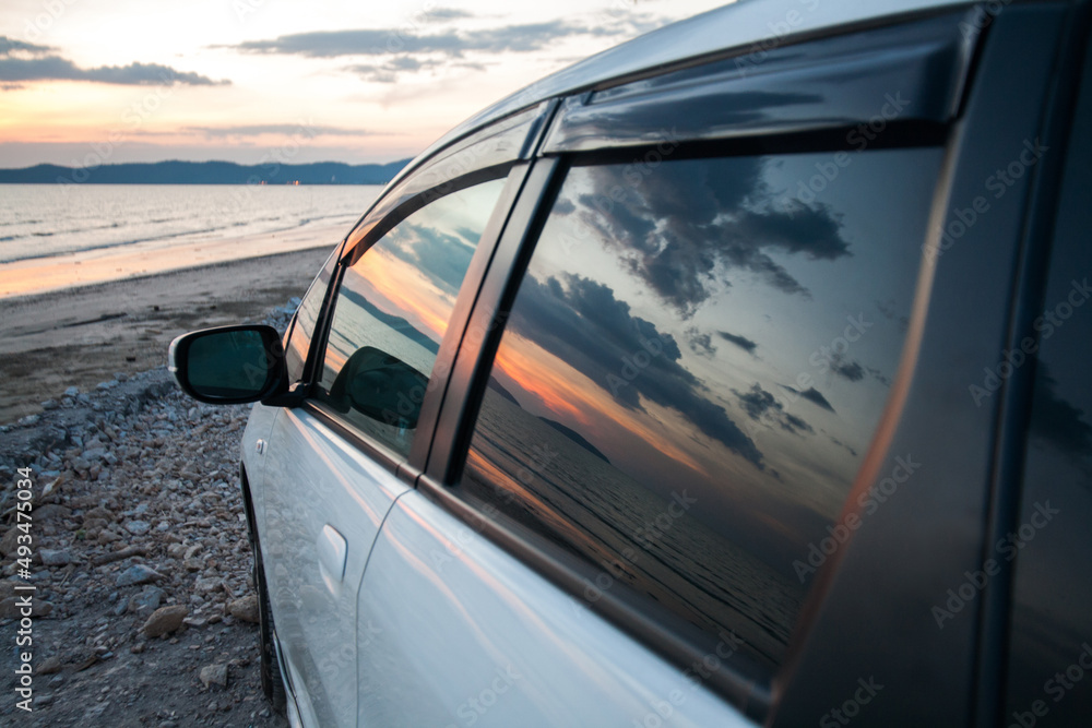 Twilight sky reflect on mirror car door for journey concept