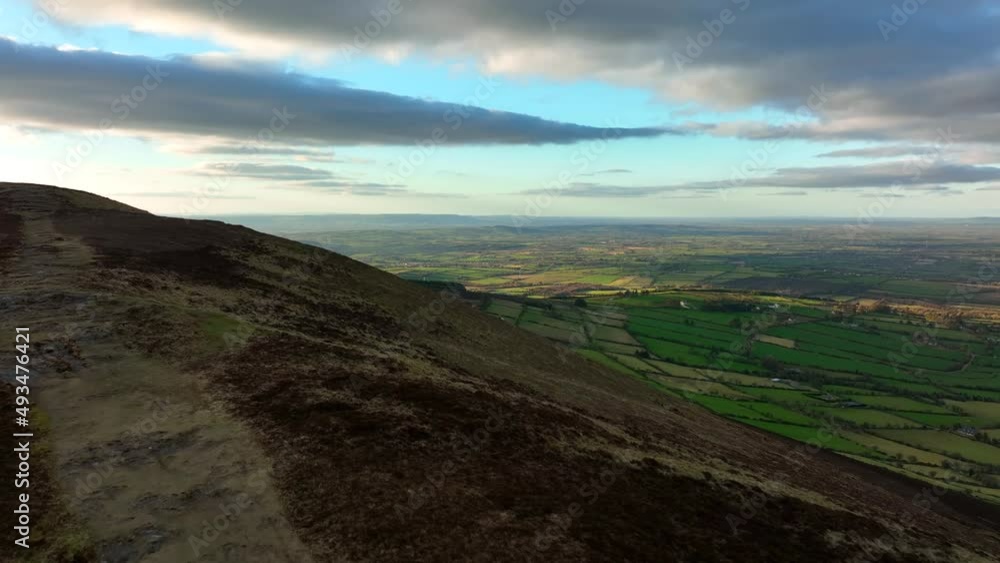 Mount Leinster, Carlow, Ireland, March 2022. Drone pulls east above Rathnageeragh hill towards the South Leinster Way with Corries Cross and Kilkenny in the distance. Mount Leinster, Carlow, Ireland, March 2022. Drone pulls east above Rathnageeragh hill towards the South Leinster Way with Corries Cross and Kilkenny in the distance.