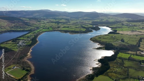 Blessington Lakes, Wicklow, Ireland, March 2022. Drone tracks east above the Liffey Reservoir towards Valleymount looking southwest towards Monamuck with Lockstown Upper in the background. photo