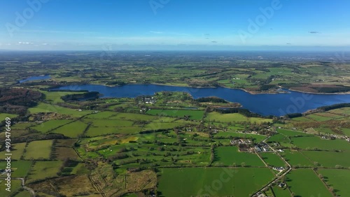 Blessington Lakes, Wicklow, Ireland, March 2022. Drone tracks south above the Liffey Reservoir facing west towards Boystown and Baltyboys Upper with Ballymore and Kildare in the background. photo