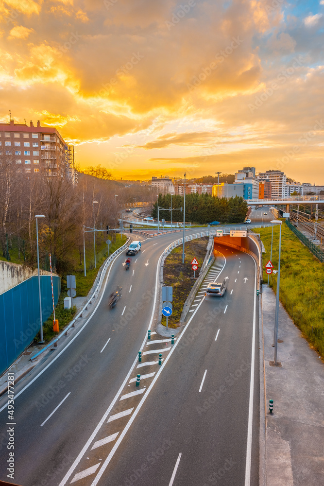 Fototapeta premium A road seen from above a sunset in San Sebastián, tourist city a spring morning. Gipuzkoa, Basque Country