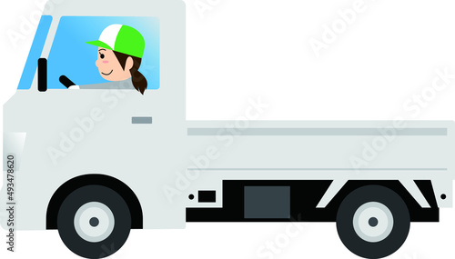 軽トラックを運転する女性