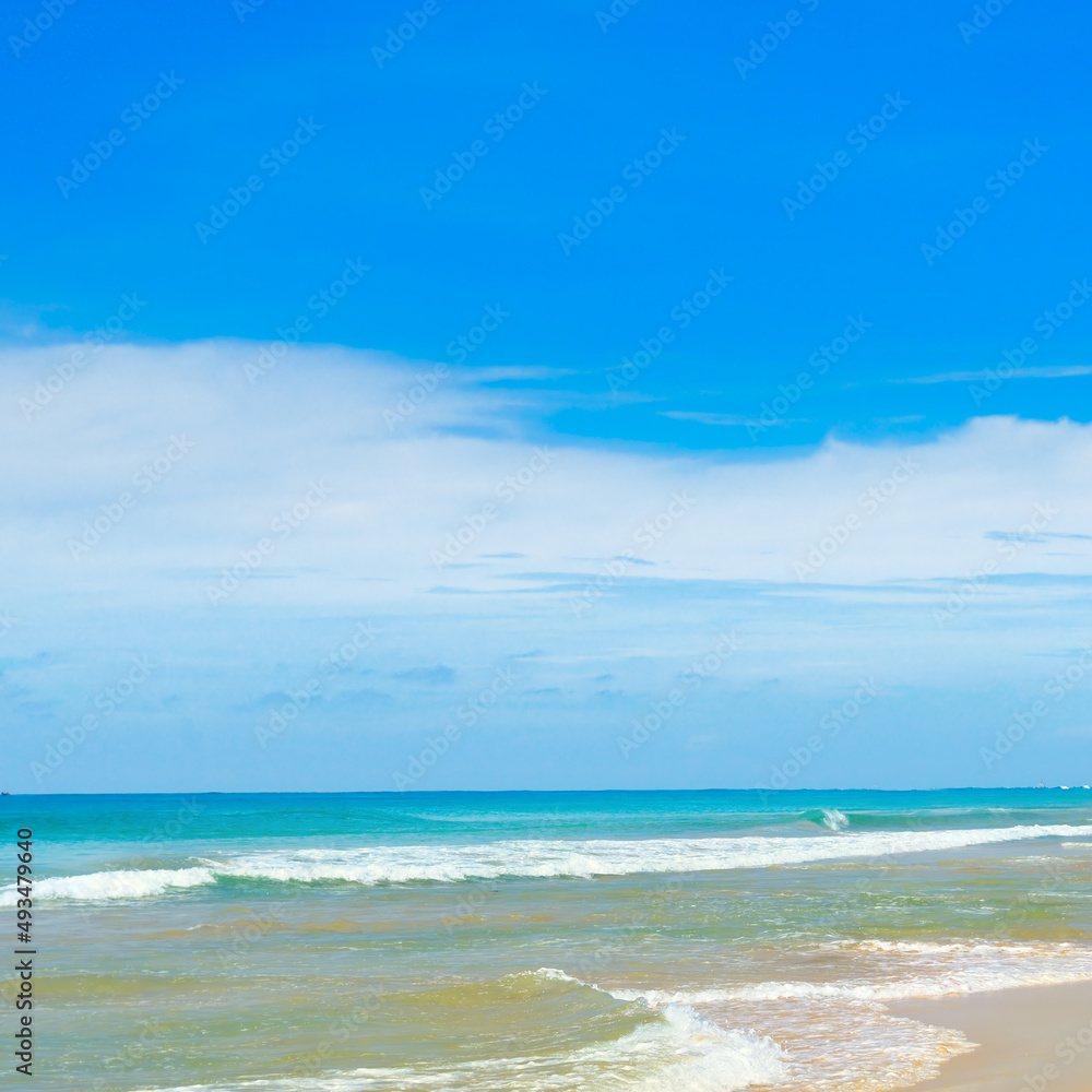 Tropical beach, azure ocean and blue sky.