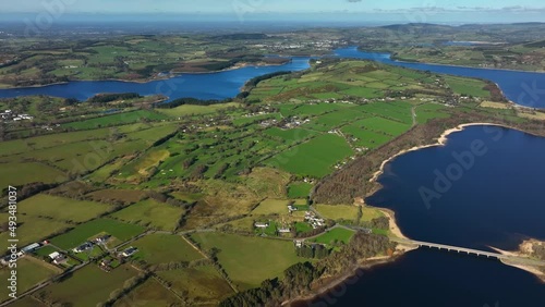 Blessington Lakes, Wicklow, Ireland, March 2022. Drone pushes northeast above the Liffey Reservoir parallel with Boystown and Baltyboys Upper with Carrig and Lackan in the distance. photo