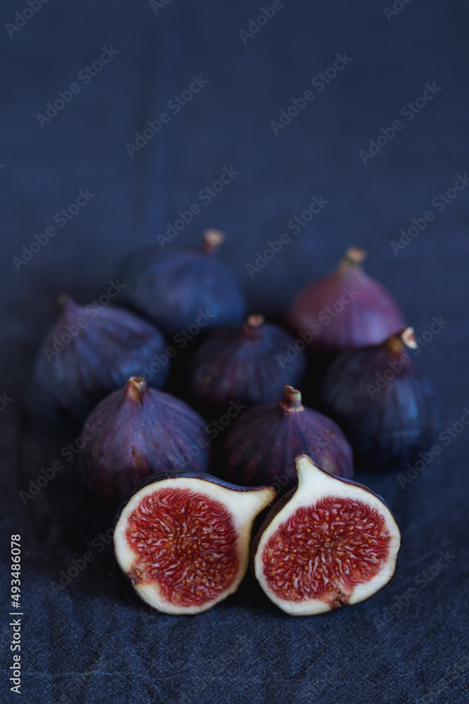 Juicy figs on dark blue background Juicy figs on dark blue background