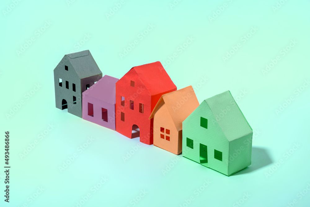 Row of different designs and colors of model houses Row of different designs and colors of model houses