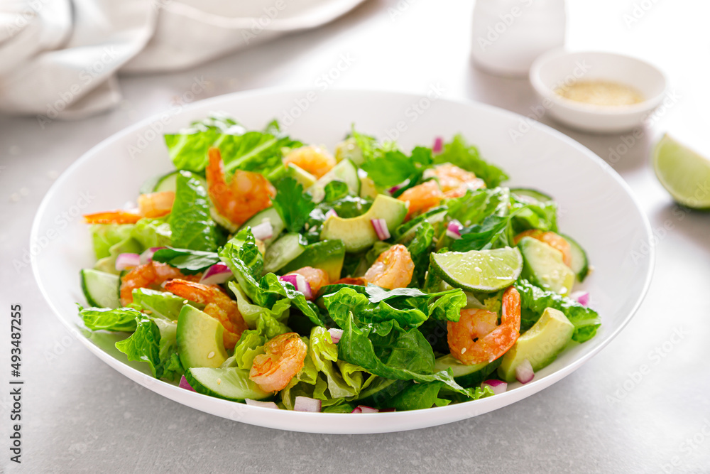 Shrimps avocado salad with cucumbers and lettuce Shrimps avocado salad with cucumbers and lettuce