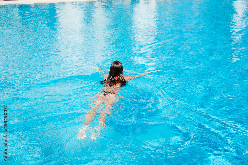 woman swim in swimming pool. summer vacation and activity
