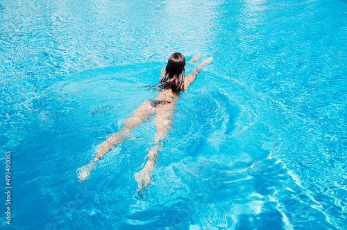 woman in the swimming pool. summer vacation and activity