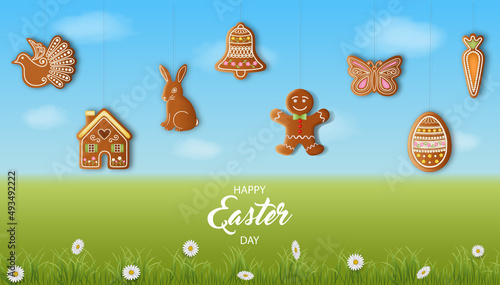 easter background with gingerbread cookies on spring landscape