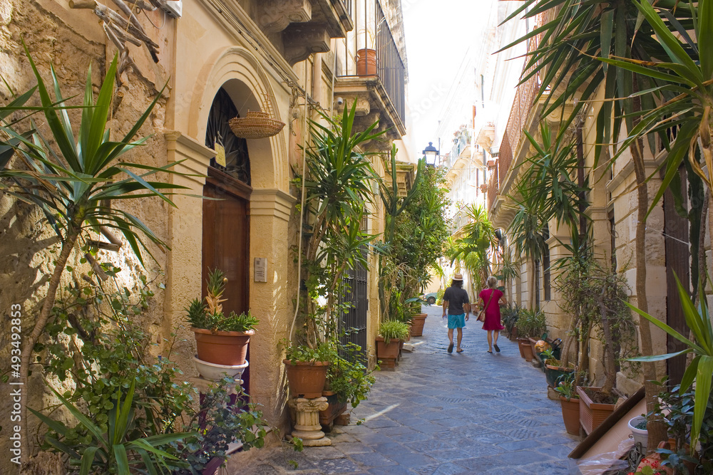 Narrow and picturesque street on Ortigia Island in Siracusa, Sicily, Italy	
