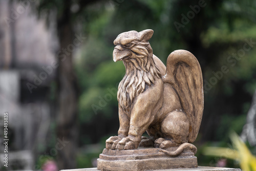 Gargoyle statue, chimeras, in the form of medieval winged monster, from the royal castle in Bana hill, Da Nang, Vietnam photo