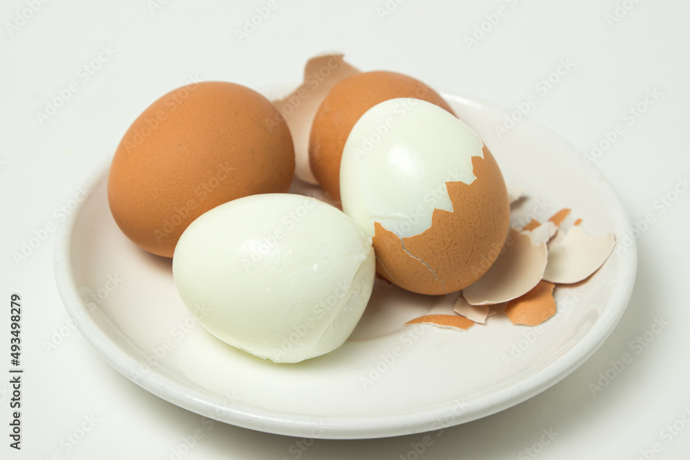 Boiled eggs on a white background. Shelled egg. Cooking chicken eggs Boiled eggs on a white background. Shelled egg. Cooking chicken eggs