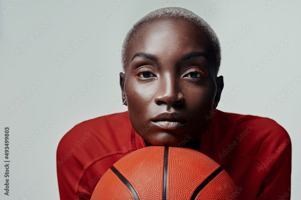 Youve seen the best, now meet me. Studio shot of an attractive young woman playing basketball against a grey background. Youve seen the best, now meet me. Studio shot of an attractive young woman playing basketball against a grey background.