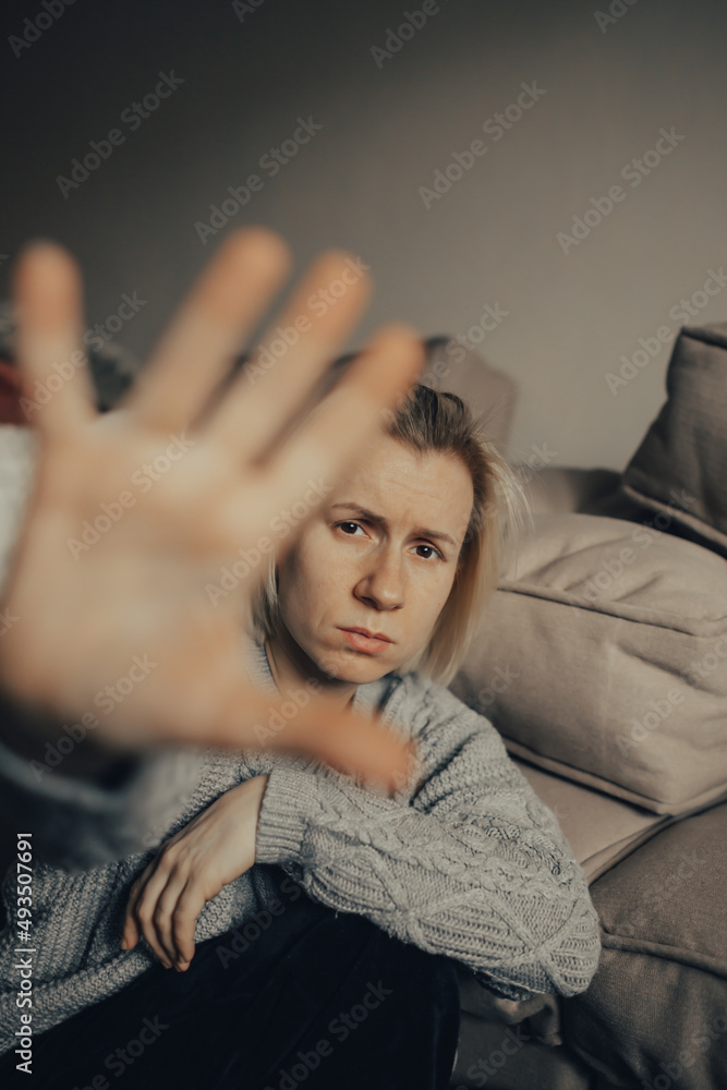 Stop the war. Pray for Ukraine. we are available to Ukraine. Ukrainian frightened woman reads war news on her phone. The woman is afraid of the sounds of air raids and explosions. The concept of fear Stop the war. Pray for Ukraine. we are available to Ukraine. Ukrainian frightened woman reads war news on her phone. The woman is afraid of the sounds of air raids and explosions. The concept of fear