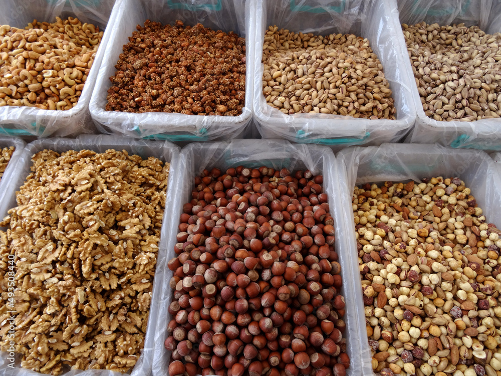 Mixed nuts and dried fruits on a farmers market stall in the Aegean coastal town Bodrum, Turkey.   