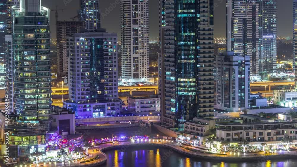 Water canal on Dubai Marina skyline at night timelapse. Water canal on Dubai Marina skyline at night timelapse.